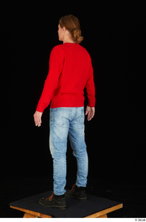 Ricky Rascal casual dressed jeans red sweater shoes standing whole…